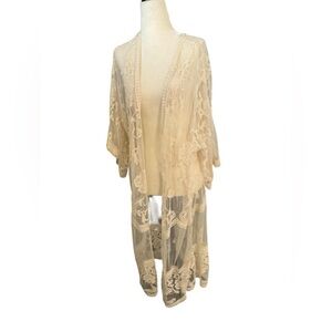 Lacy sheer cover up to use at dinner or over a swimsuit.No brand tag